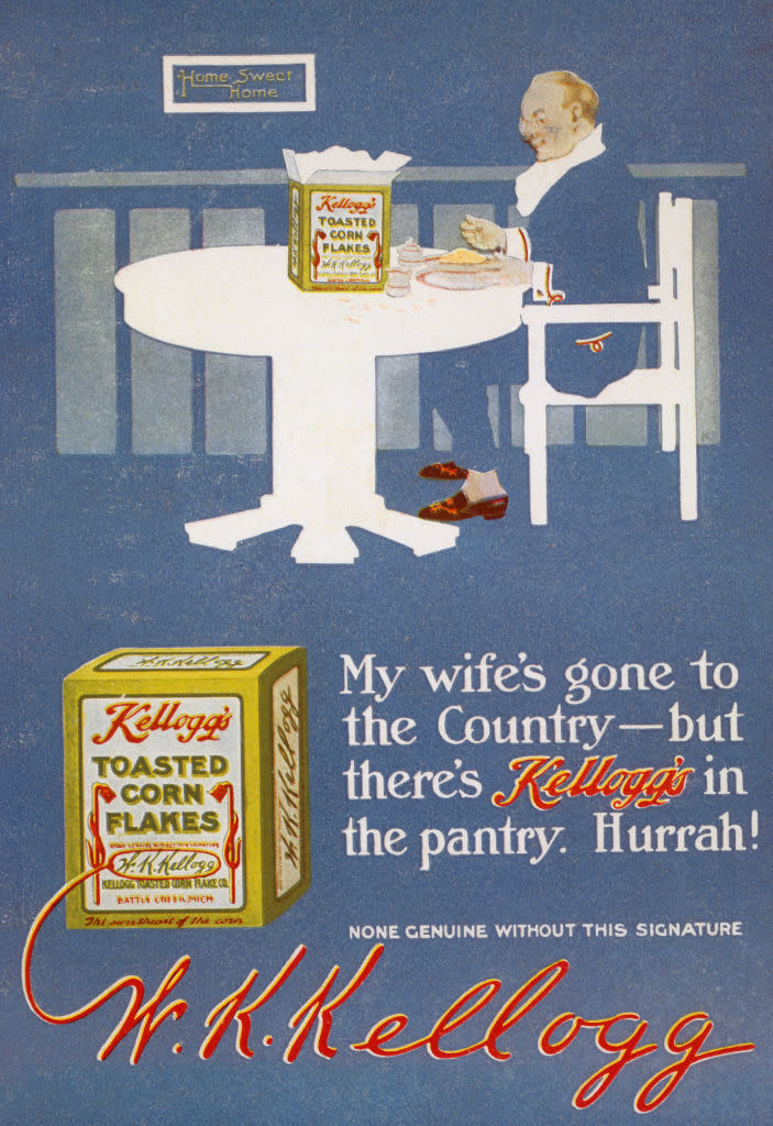 An advertisement featuring W.K. Kellogg at a table beside a Kellogg's Toasted Corn Flakes box. Text: "My wife's gone to the Country – but there's Kellogg's in the pantry. Hurrah!"