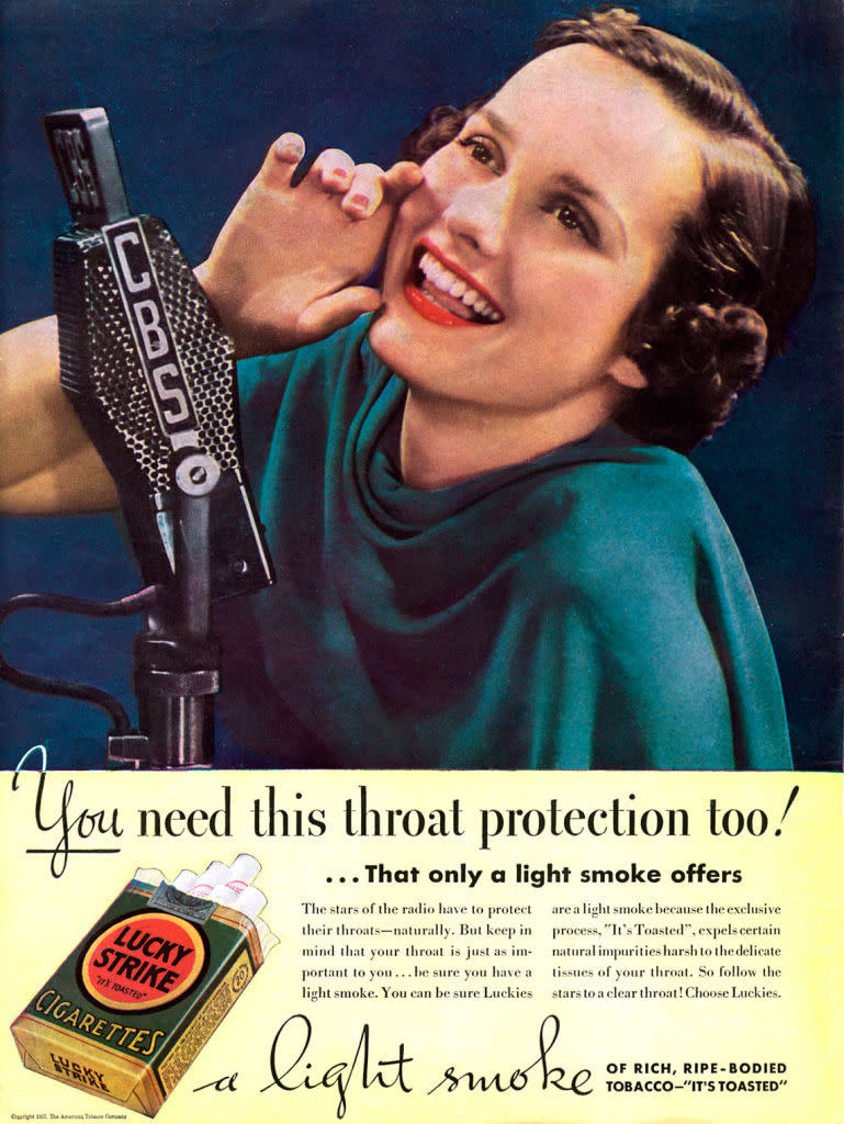 A vintage advertisement featuring a smiling woman posing with a microphone and a Lucky Strike cigarette pack, promoting the slogan, "a light smoke."