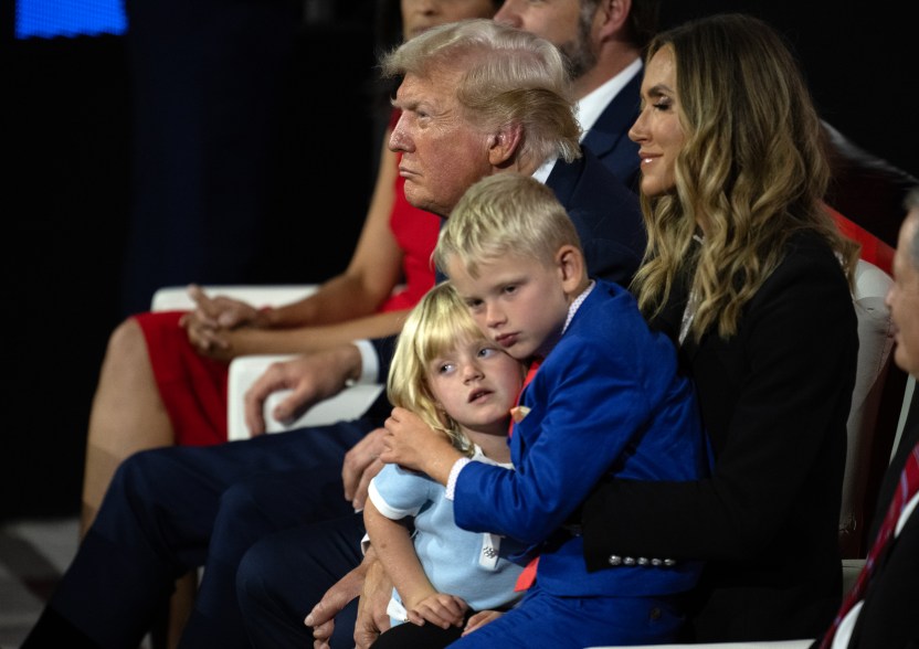 Donald Trump, Lara Trump, and his grandchildren listen as Eric Trump, makes remarks.