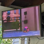 An outdoor TV with Miraculous Ladybug on it