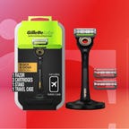 razor blade and package against red gradient