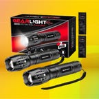 two black flashlights against packaging box and two small remotes against peach, orange, yellow and mint green background