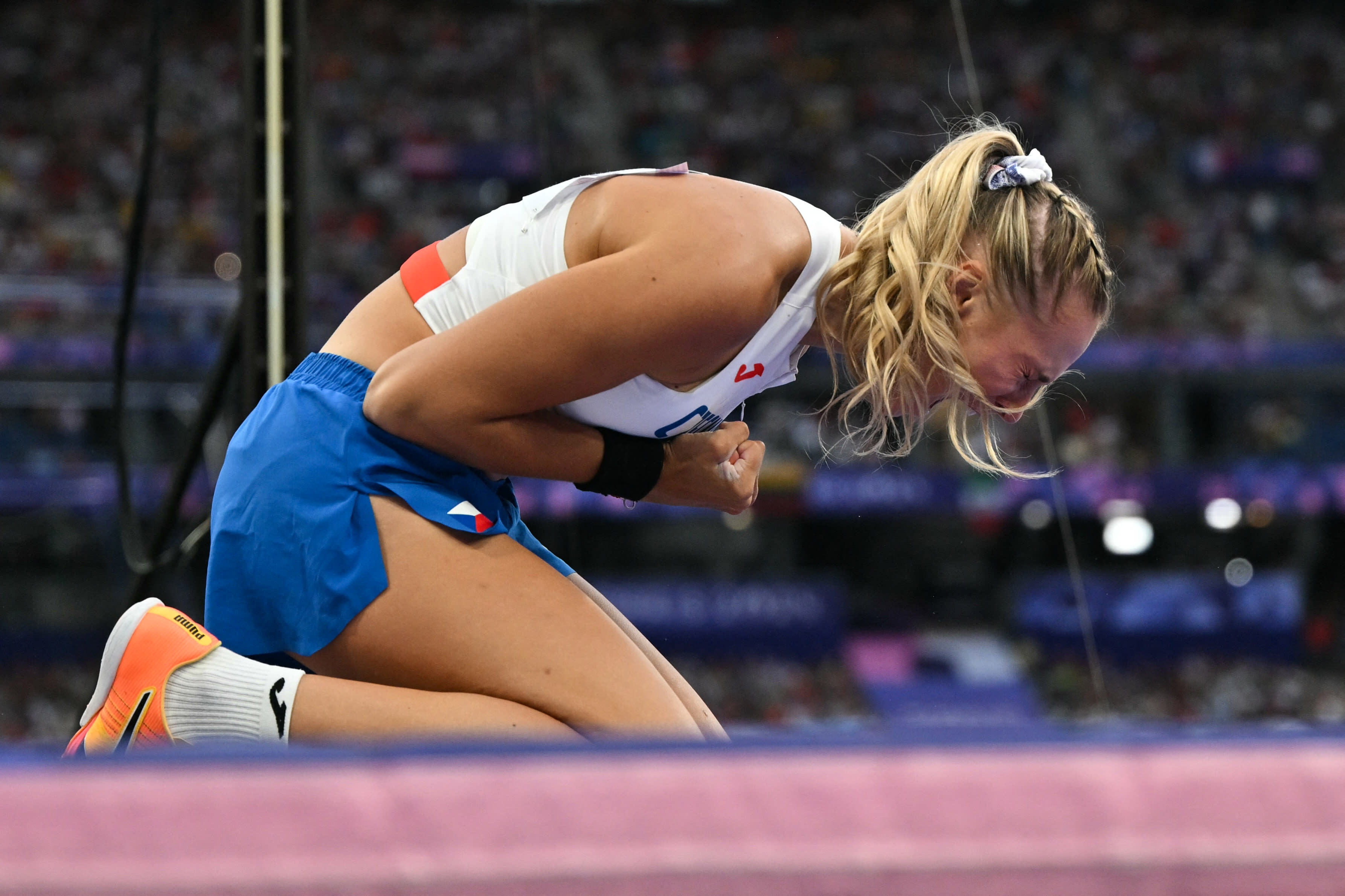 TOPSHOT - Czech Republic's Amalie Svabikova reacts in the women's pole vault final of the athletics event at the Paris 2024 Olympic Games at Stade de France in Saint-Denis, north of Paris, on August 7, 2024. (Photo by Andrej ISAKOVIC / AFP) (Photo by ANDREJ ISAKOVIC/AFP via Getty Images)
