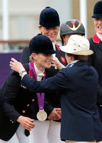 <p>ADRIAN DENNIS/AFP/Getty</p> Zara Phillips receives her silver medal from her mother Princess Anne for the team equestrian eventing at the 2012 London Olympics on July 31, 2012.
