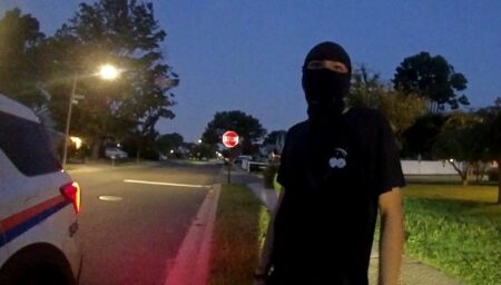 New York county makes first arrest under new mask ban law