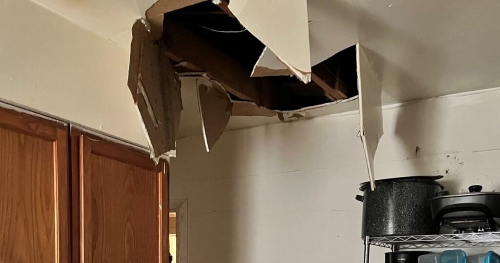 Officials were looking for a murder suspect. then he crashed through the ceiling