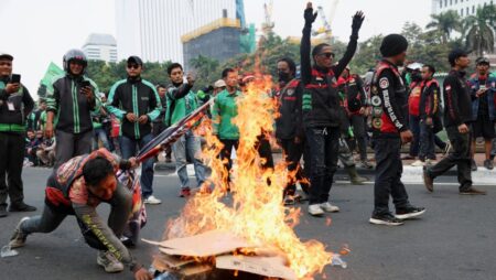 Indonesian app-based motorcycle taxi drivers strike in protest over low pay