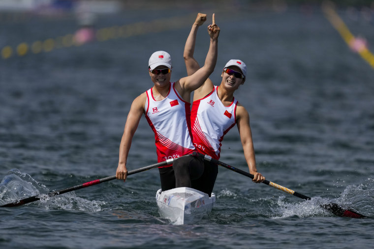China's Sun Mengya and Xu Shixiao react to winning gold in the women's canoe double 500-meter finals