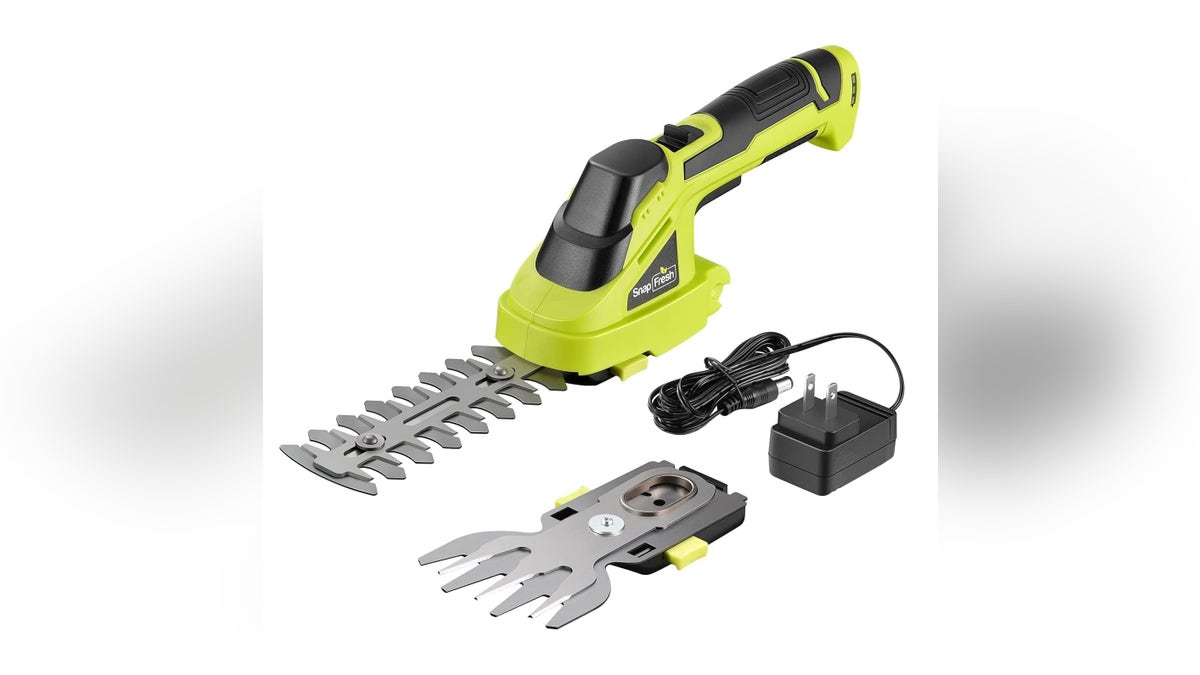 Easily trim hedges and bushes with an electric trimmer.
