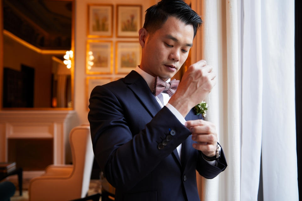 Groom getting dressed