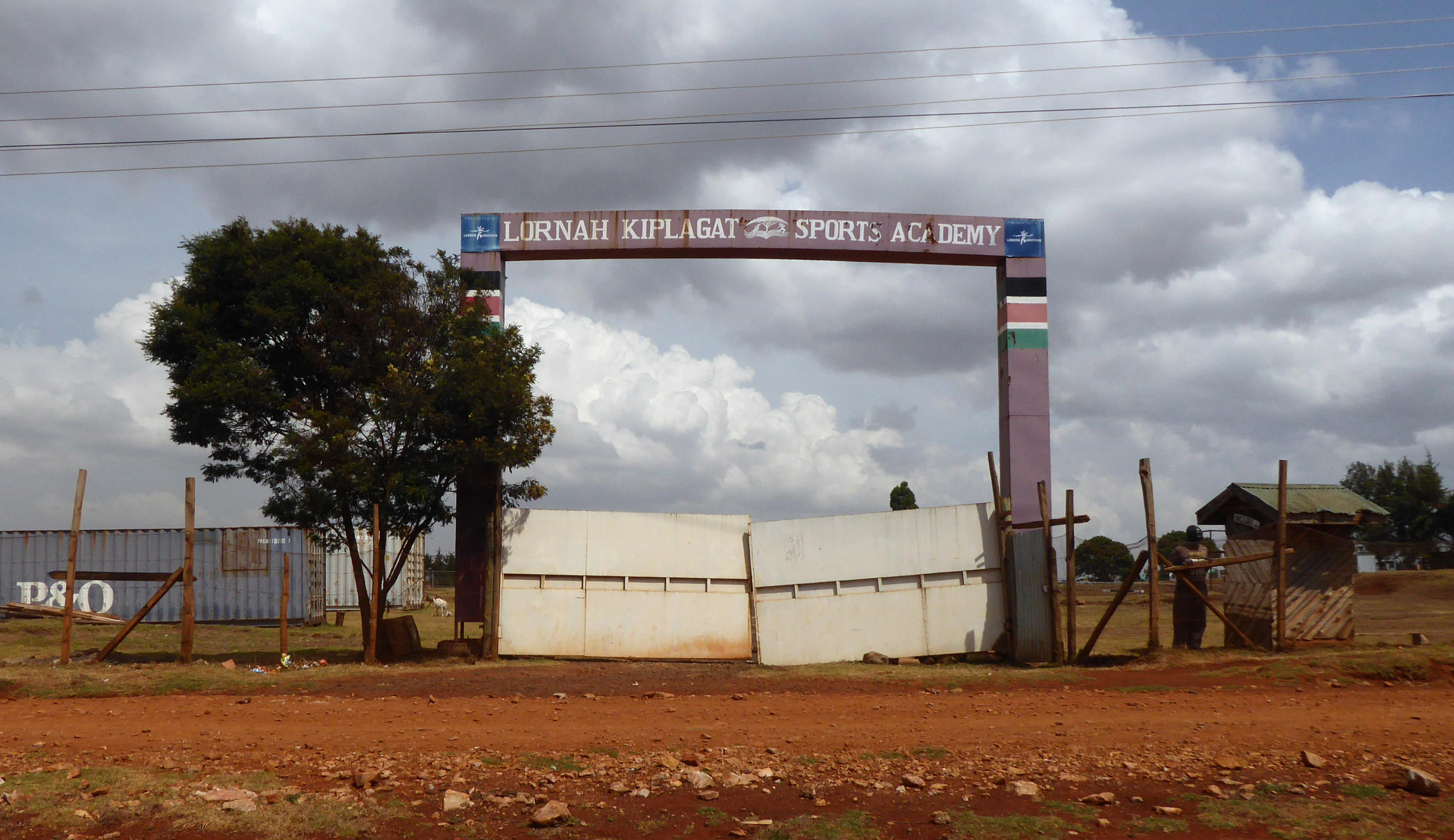 26 February 2019, Kenya, Iten: The entrance gate to the training centre of former marathon runner Lornah Kiplagat, who was born in Iten and later started for the Netherlands. Located 2400 metres above sea level, Iten is the heart of Kenya's running scene and a place of longing for many European athletes and ambitious hobby runners. (to dpa-KORR.: