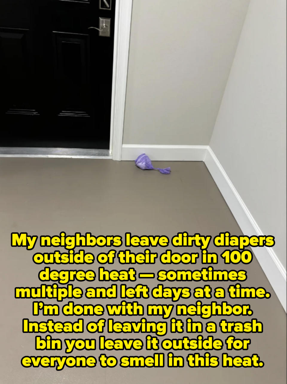 Purple dog waste bag in the corner of a floor near a closed door