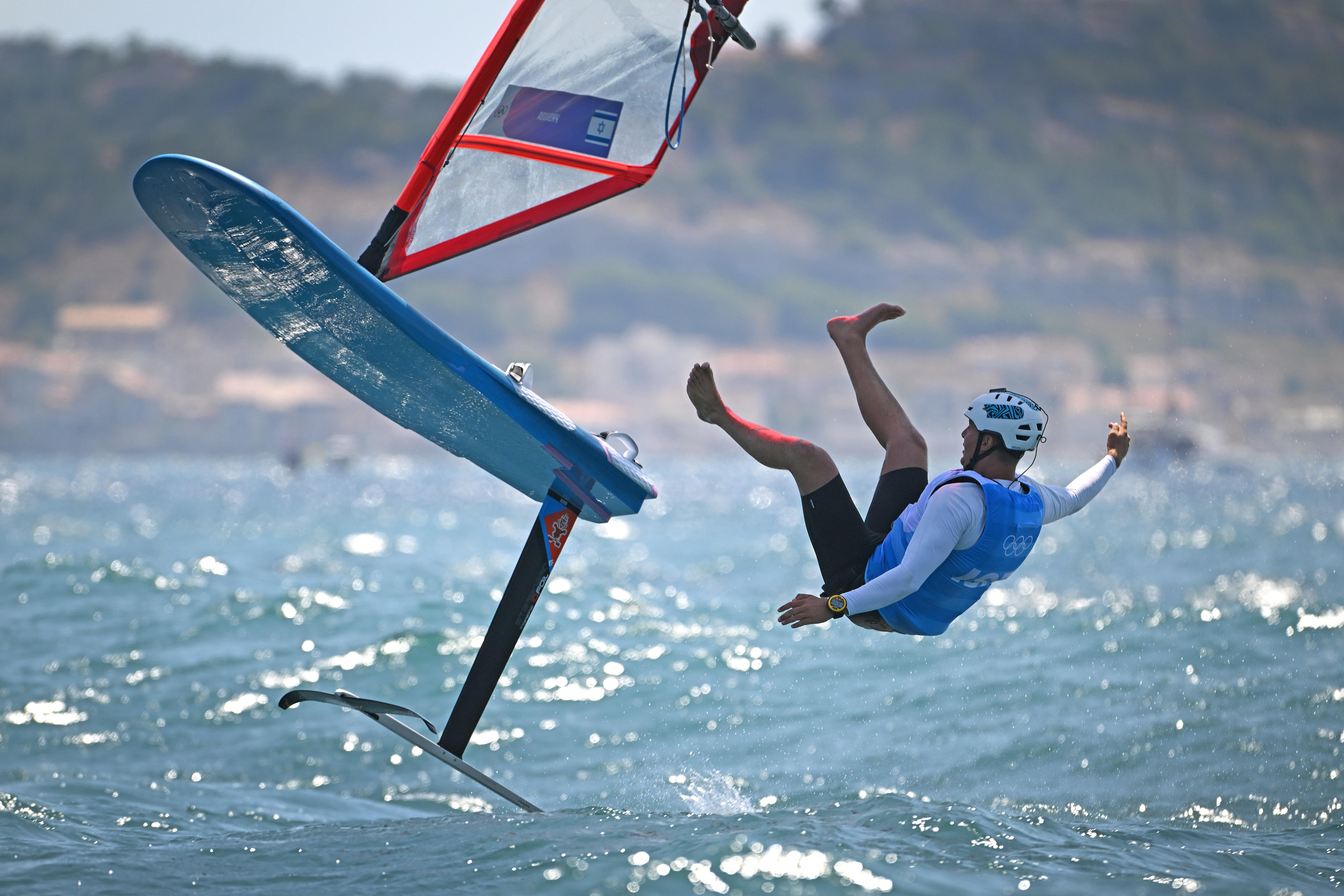 Tom Reuveny of Team Israel celebrates winning the Gold medal in the Men's Windsurf iQFoil class final on day eight of the Olympic Games at Marseille Marina on August 03, 2024 in Marseille, France. (Clive Mason/Getty Images)