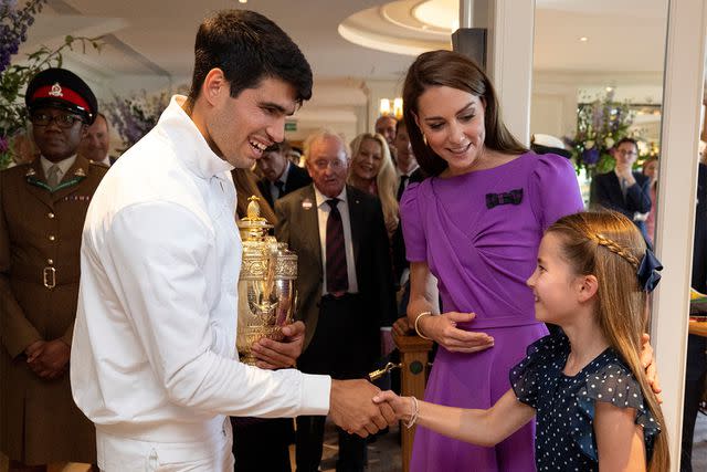 <p>ANDREW PARSONS/POOL/AFP via Getty</p> Carlos Alcaraz, Kate Middleton and Princess Charlotte at the Wimbledon Tennis Championships on July 14, 2024.