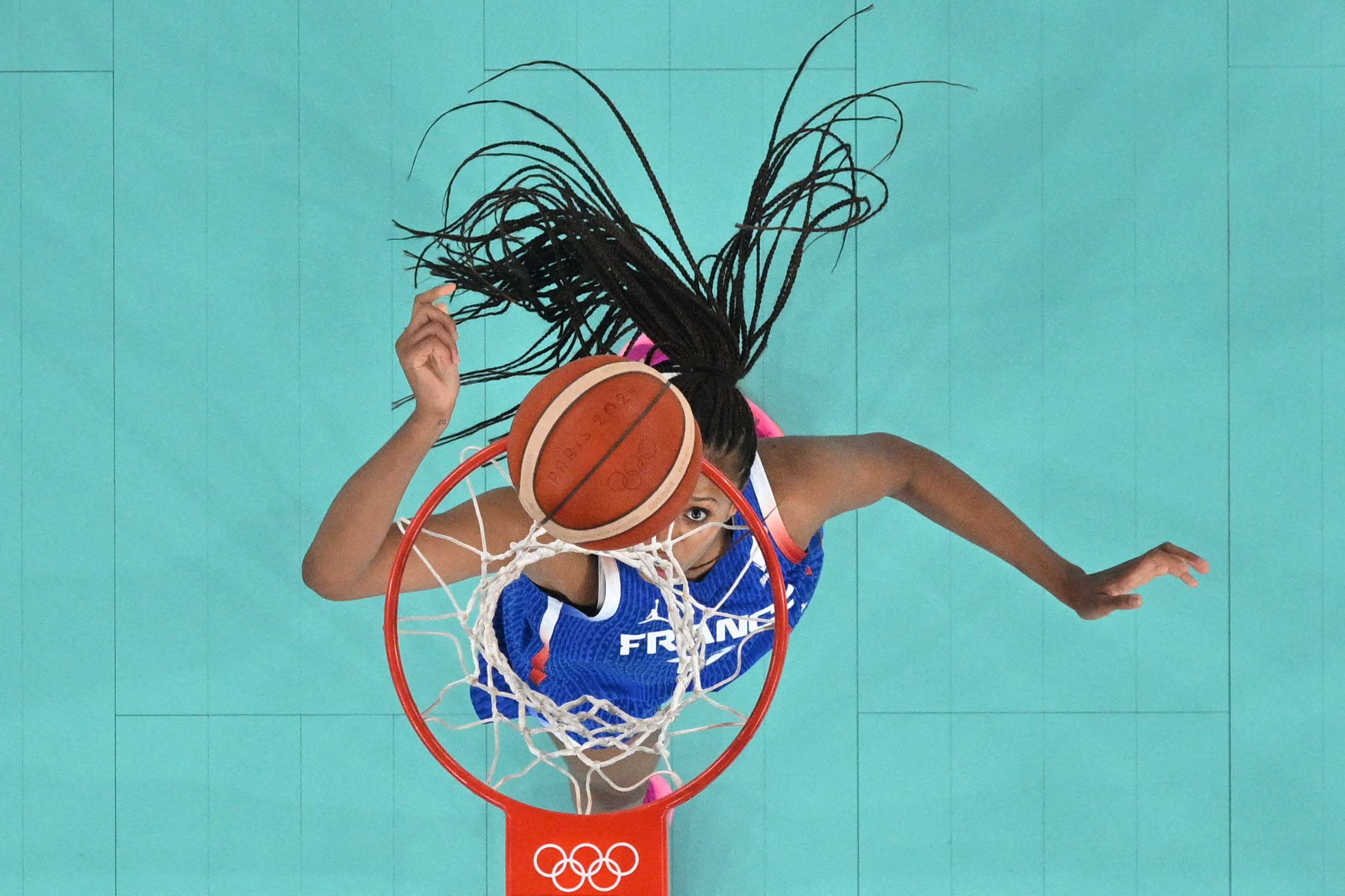 TOPSHOT - An overview shows France's #12 Iliana Rupert go to the basket and score in the women's quarterfinal basketball match between Germany and France during the Paris 2024 Olympic Games at the Bercy Arena in Paris on August 7, 2024. (Photo by Aris MESSINIS / POOL / AFP) (Photo by ARIS MESSINIS/POOL/AFP via Getty Images)