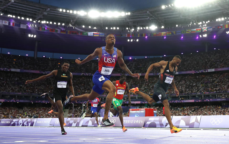 Hall crosses the finish line, in first by four-hundredths of a second. (Christian Petersen/Getty Images)