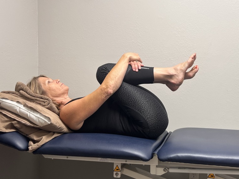 Double knees to chest exercise.