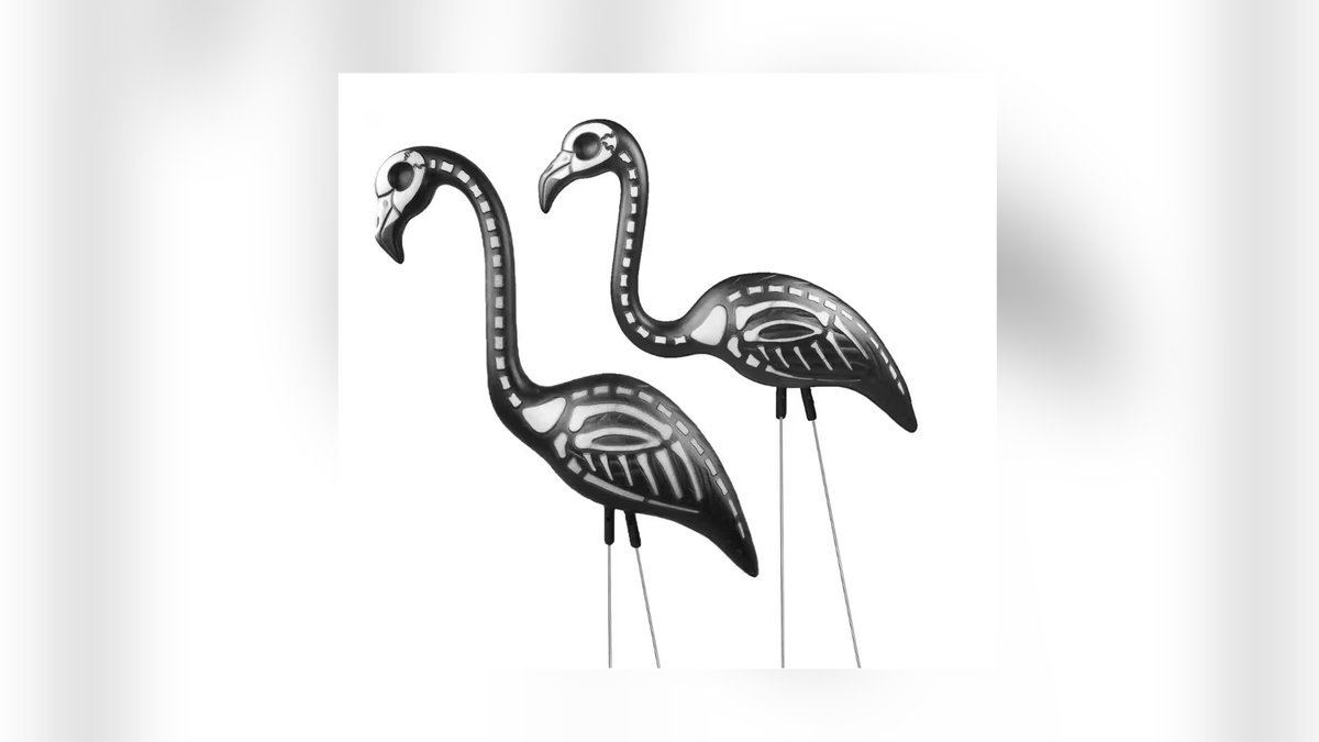 Skeleton flamingos add some festive Halloween decor to your yard.