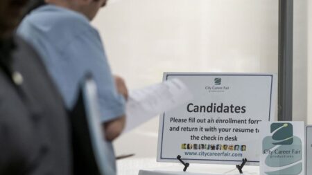 Dow closes nearly 700 points higher after latest jobless data brings better news for America’s labor market