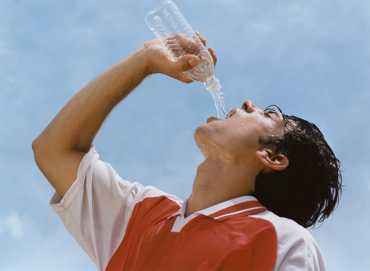 soccer player drinking water