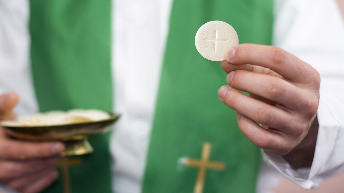 It is a Holy Communion, studio shot composition.