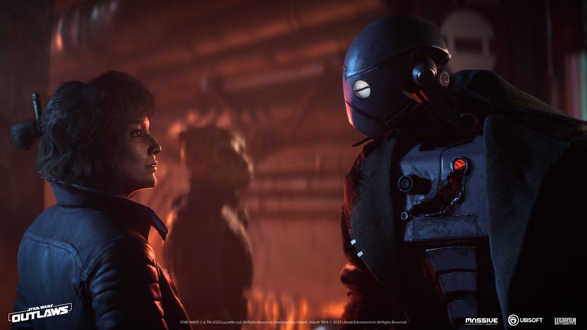 A woman talks with a robot in a space trenchcoat. Yeah, his design rules.
