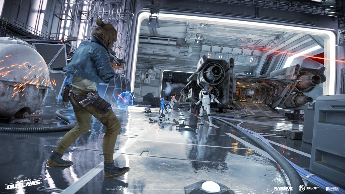 A woman standing in a brightly lit docking bay shoots enemies across the room.