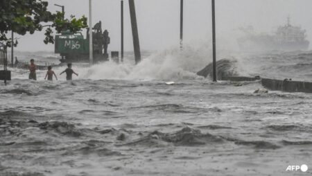 More than 10 dead as tropical storm floods Philippines, disrupting schools and flights