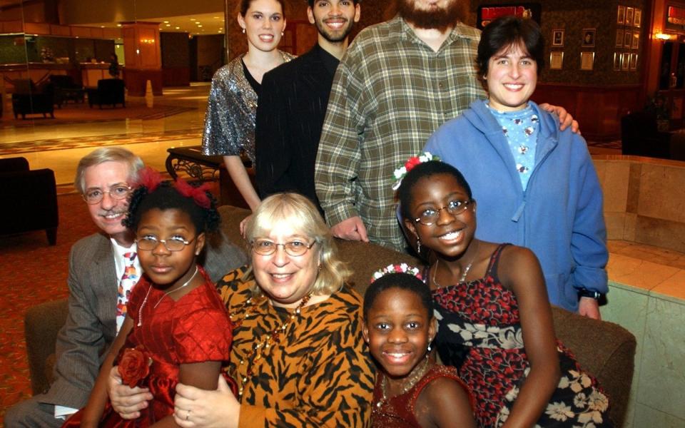 Michaela DePrince (bottom row second from right) and her family