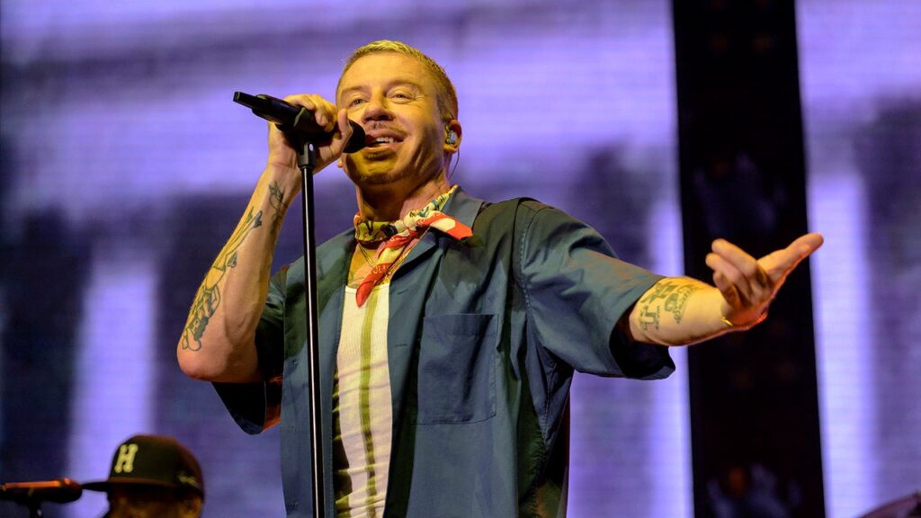 Macklemore declares ‘F— America’ to cheers at Seattle concert benefiting UN agency with alleged Hamas ties
