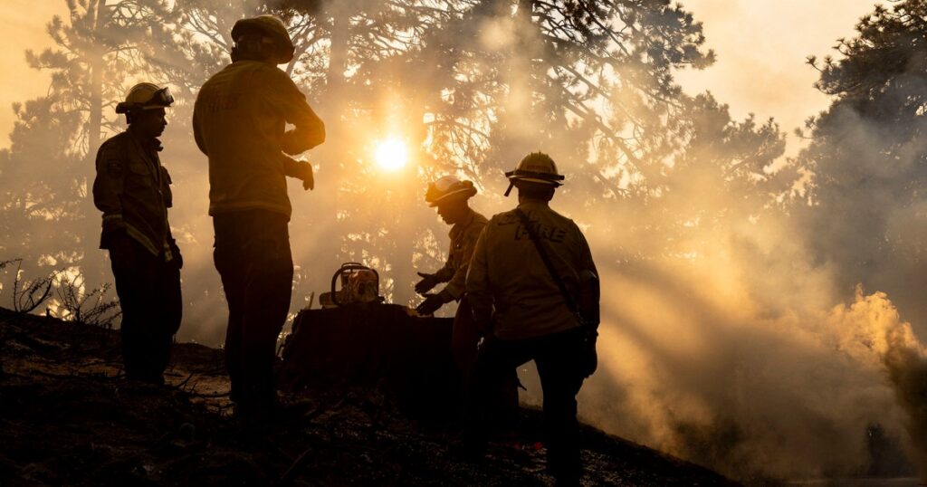 Los Angeles wildfires slow, still threaten suburbs