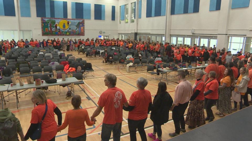 The 40-minute healing walk was cancelled because of rain showers in Regina, but attendees rallied in layered circles indoors to honour the healing walk and do a Round Dance instead.  