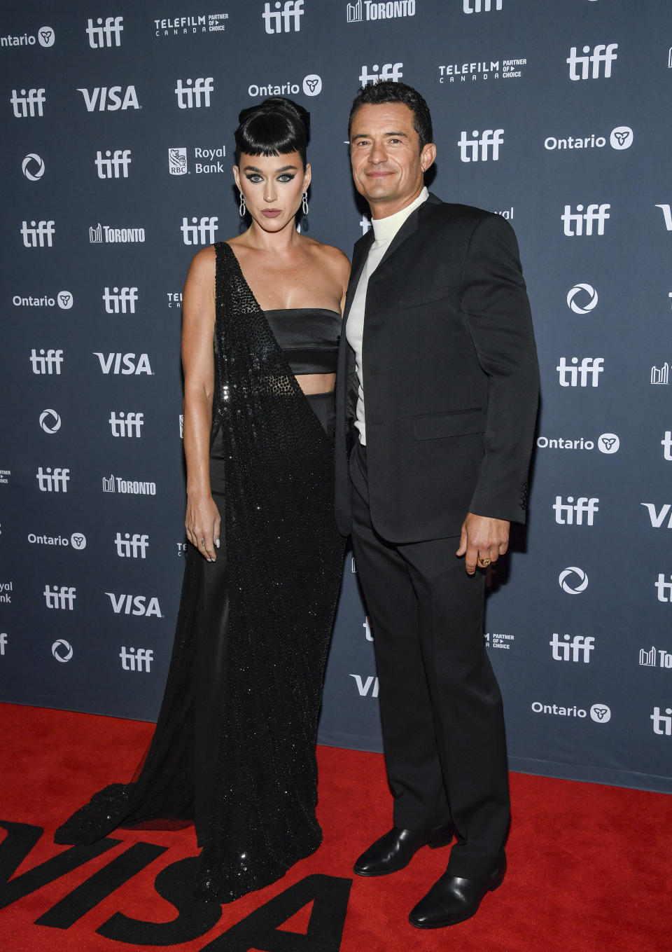 Katy Perry, left, and Orlando Bloom attend the premiere of 
