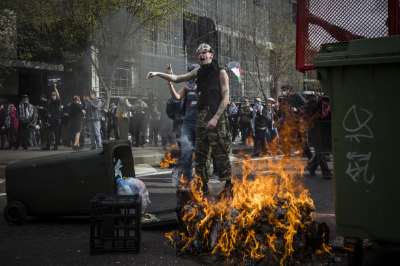On Wednesday, mounted police forced protesters back to Spencer Street, where they set bins and rubbish on fire.