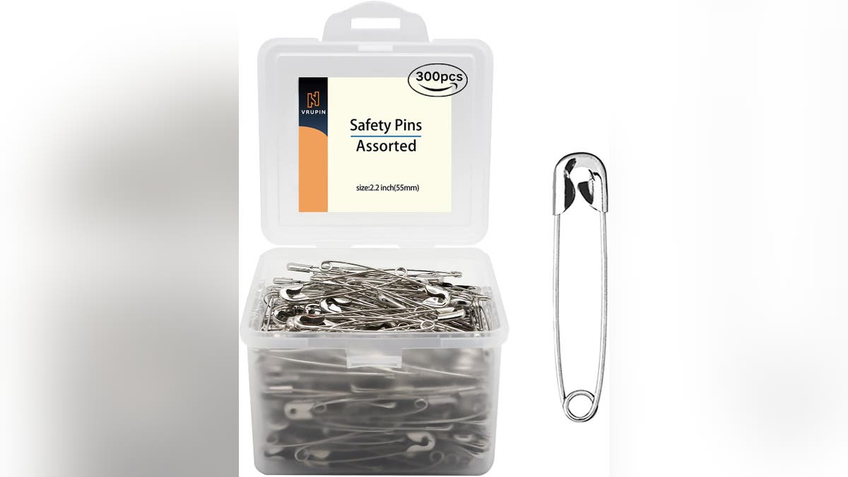 Pin together the mummy costume using safety pins.