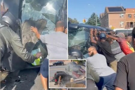Brooklyn bystanders show incredible strength to rescue driver from overturned minivan— only to find bottles of booze next to him: video