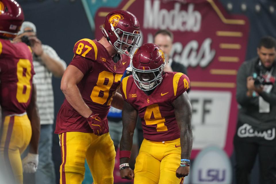 Southern California running back Woody Marks (4) celebrates with tight end Lake McRee (87) after scoring a touchdown with eight seconds left against LSU at Allegiant Stadium.