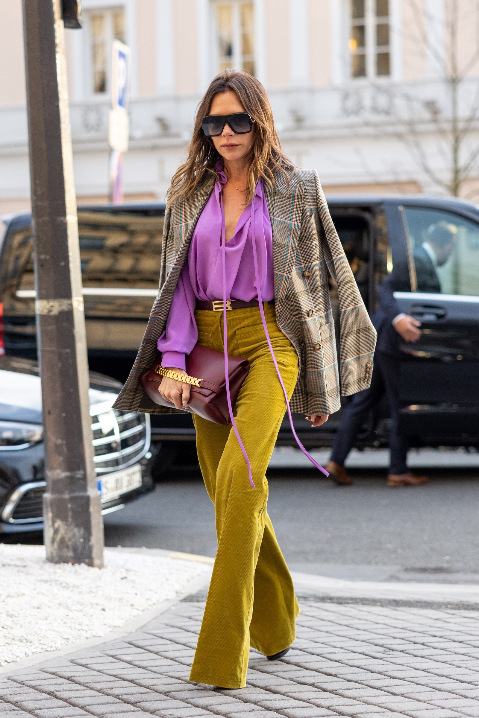 Image may contain Victoria Beckham Clothing Pants Accessories Glasses Bag Handbag Footwear Shoe Person and Teen