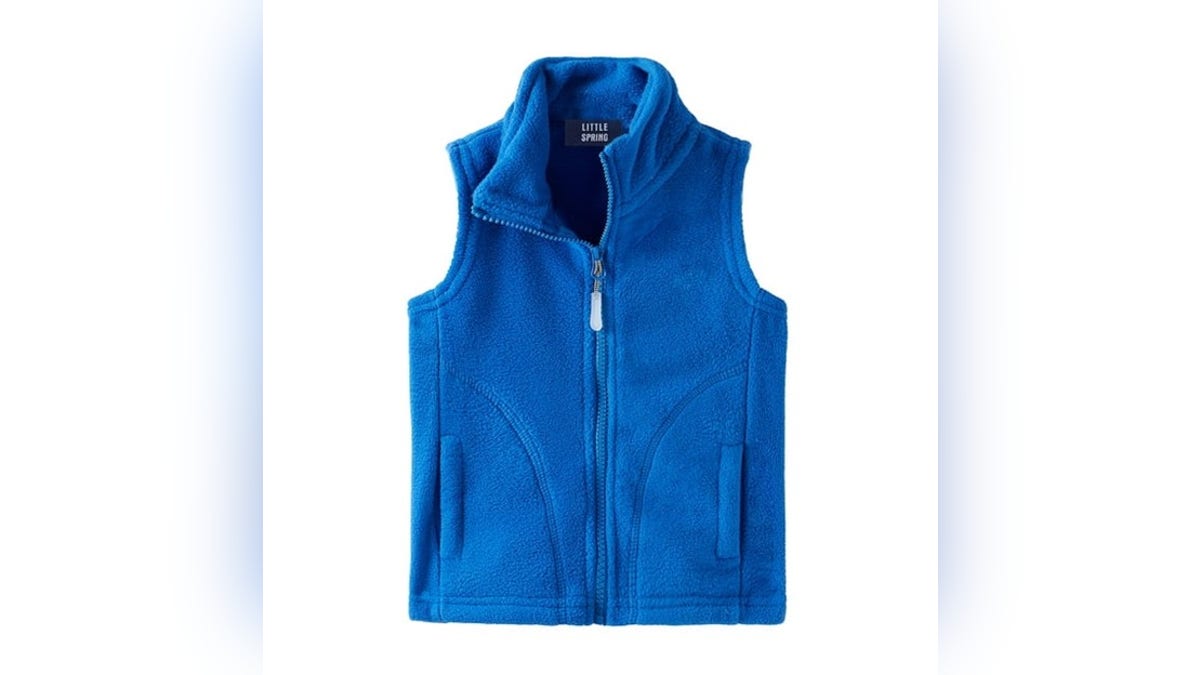 Pull together the outfit with a blue vest.