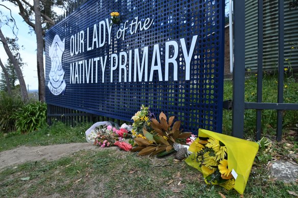Floral tributes lay at the entrance to Our Lady of the Nativity Primary in Lawson.
