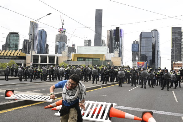 An anti-war protester is shot by a rubber bullet on Wednesday.