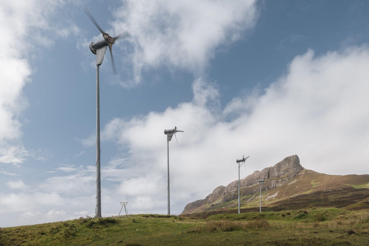 Wind turbines on a hillside.