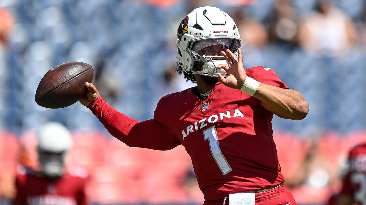 Arizona Cardinals quarterback Kyler Murray in warm ups, preparing to throw a ball with his right hand.
