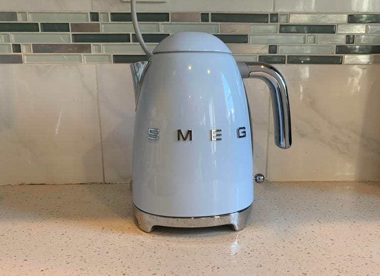 Blue electric kettle on counter