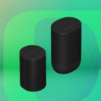 Black Sonos Move 2 speaker and Era 100 speaker displayed on a gradient green-blue background