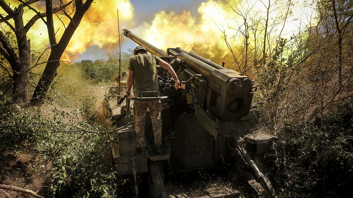 In this photo provided by Ukraine's 24th Mechanised Brigade press service, servicemen of the 24th Mechanised Brigade fire a "Giatsint-S" 152mm self-propelled howitzer towards Russian positions near Chasiv Yar town, in Donetsk region, Ukraine, Tuesday, Aug. 20, 2024. 