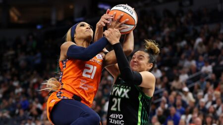 Sun’s DiJonai Carrington held back by teammate after hard foul vs Lynx