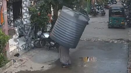Video captures water tank falling on woman — but she miraculously escapes injury