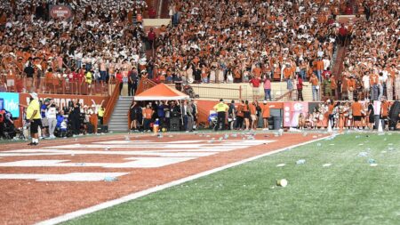 Texas fined $250,000 for fans throwing debris on field, 'required' to find those who did so