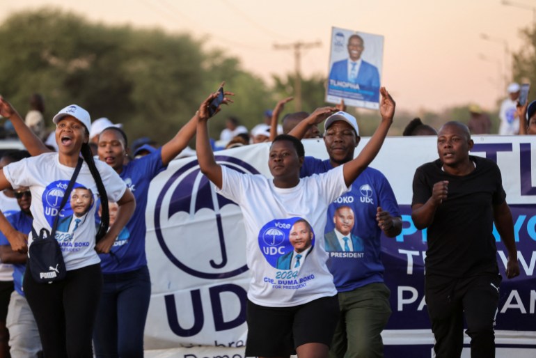 Umbrella for Democratic Change (UDC) supporters leave the final rally in Tlokweng, east of Gaborone, Botswana